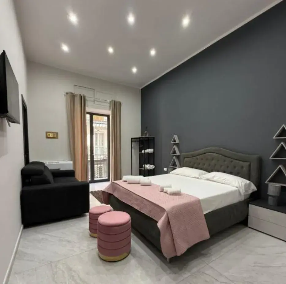 Camera Quadrupla con balcone, letto matrimoniale e divano letto