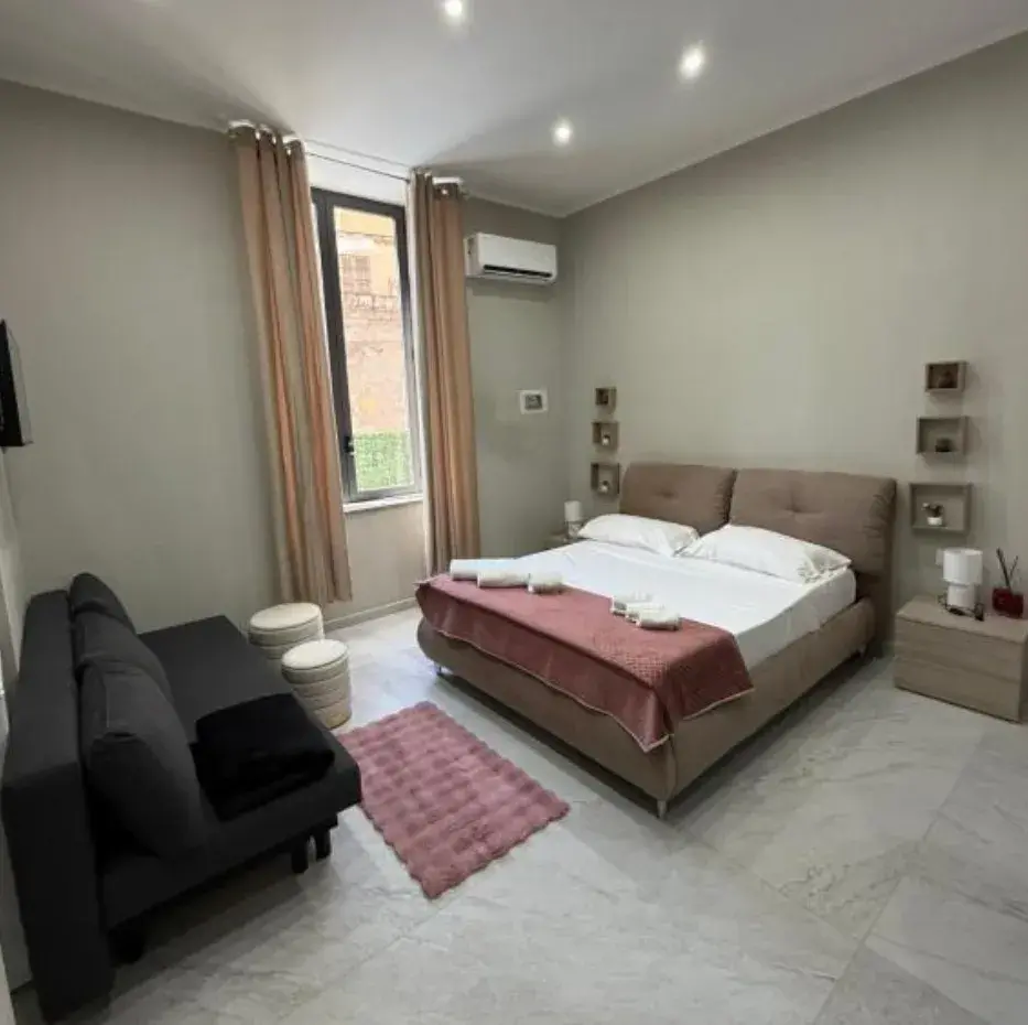 Camera Quadrupla Comfort con letto matrimoniale e divano letto